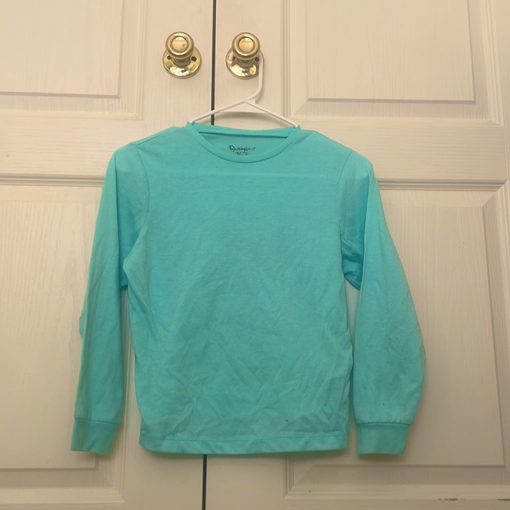 Kid’s blue pajama shirt